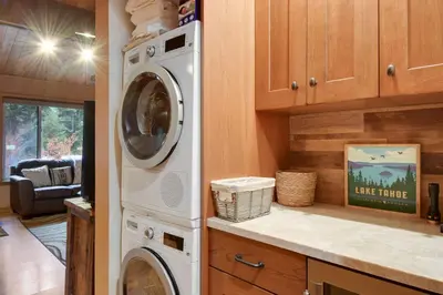 a kitchen with a washer and dryer in a house at North Lake Tahoe Alpine Retreat 5 Min to Skiing in Alpine Meadows