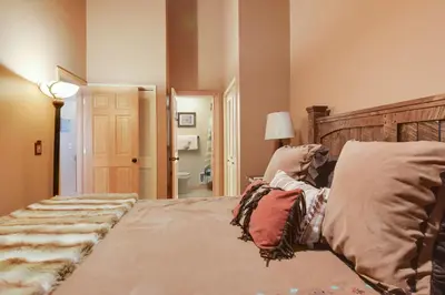 a bedroom with a bed with pillows on it at North Lake Tahoe Alpine Retreat 5 Min to Skiing in Alpine Meadows