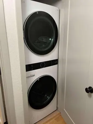 two washers and a dryer in a closet at Pino Point Steps to Tahoe Beaches in Tahoe Vista