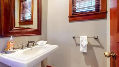a bathroom with a white sink and a mirror at Timbers #2 townhouse in Mammoth Lakes