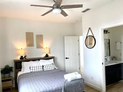 a bedroom with a bed and a ceiling fan at Huge Home near Old Folsom Pet & Family Friendly in Folsom