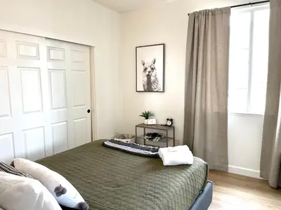a bedroom with a bed and a window at Huge Home near Old Folsom Pet & Family Friendly in Folsom