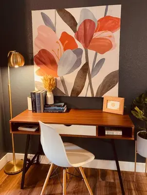 a desk with a chair and a painting on the wall at Remodeled Excellent Neighborhood in Roseville