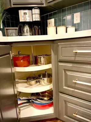 a kitchen cabinet with pots and pans on shelves at Remodeled Excellent Neighborhood in Roseville