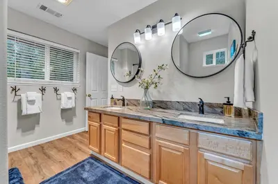 a bathroom with a sink and a mirror at Tahoma Family Getaway with Bocce Ball & BBQ Grill in Tahoma