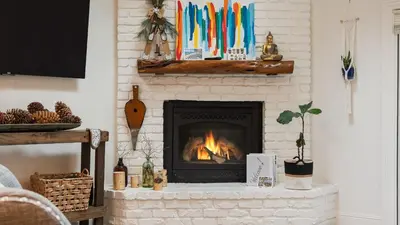 a living room with a fireplace with a fire place at Ski Way by AvantStay Cozy Tahoe Home w Fireplace Balcony in Incline Village