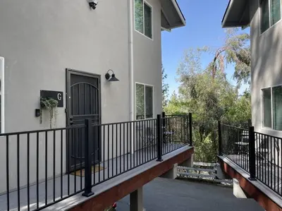 a balcony of a house with a black door at Gorgeous views 1st Apple hill exit Family Fun in Placerville