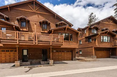 a large wooden house with a garage at Mountainside 14 in Mammoth Lakes