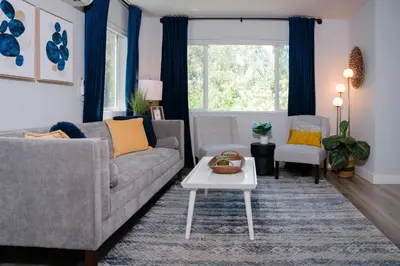 a living room with a couch and a table at Family Friendly 1st Apple Hill exit Tahoe in Placerville