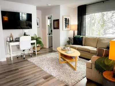 a living room with a couch and a table at Enjoy the outdoors 1st Apple hill exit Tahoe in Placerville