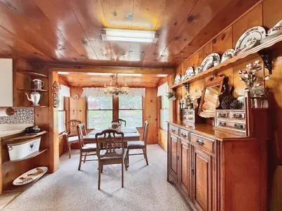 a kitchen with a table and a dining room at Homestead Ranch near Yosemite with Horses and Chickens in Midpines