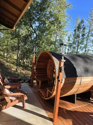 a large wooden boat on a deck with a lamp at Private Lakeview Yosemite Full House El Capitan with Panoramic Sauna, Seasonal HotTub, WiFi in Groveland