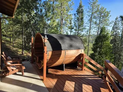 a wooden boat sitting on top of a deck at Private Lakeview Yosemite Full House El Capitan with Panoramic Sauna, Seasonal HotTub, WiFi in Groveland