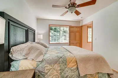 a bedroom with a bed and a ceiling fan at Truckee Retreat half Mi to Tahoe Donner Skiing in Truckee