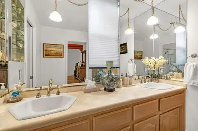 a bathroom with two sinks and a large mirror at Fully Renovated 3Bd at Yosemite's South Gate in Fish Camp
