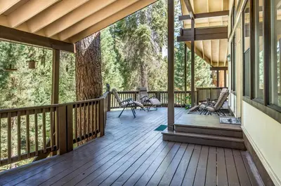 a porch of a house with a wooden deck at Fully Renovated 3Bd at Yosemite's South Gate in Fish Camp