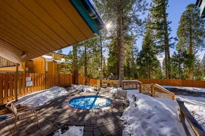 a patio with a swimming pool in the snow at #LazyBear Tahoe Dreamy Escape in Tahoe Vista