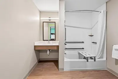 a bathroom with a sink and a shower at ECHO Suites Extended Stay by Wyndham Reno in Reno