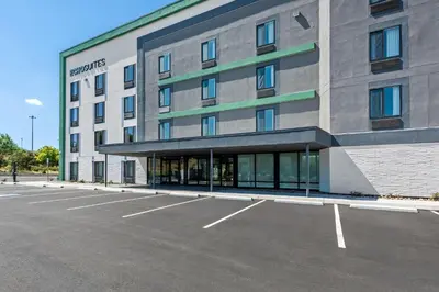 an empty parking lot in front of a hotel at ECHO Suites Extended Stay by Wyndham Reno in Reno