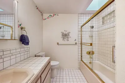 a bathroom with a tub and a toilet and a sink at Deer Paradise in Coarsegold