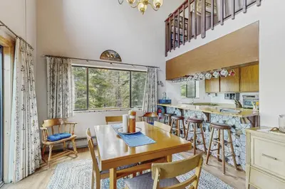 a kitchen and dining room with a table and chairs at The Garden Haus in Incline Village