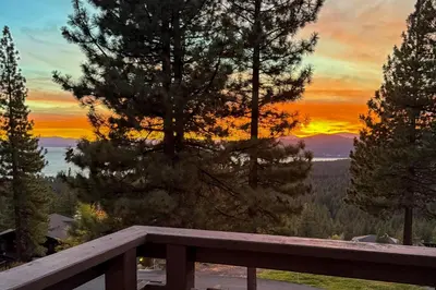 a view of a sunset from a wooden bench at The Garden Haus in Incline Village
