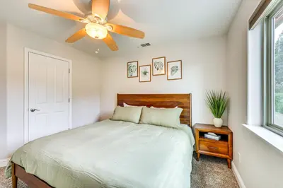 a bedroom with a bed with a ceiling fan at Hot Tub, Games and Sports Luxury Yosemite Escape in Oakhurst