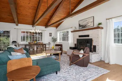 a living room with a couch and a fireplace at Yosemite Family Ranch in Oakhurst