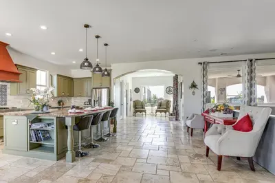 a kitchen and living room with a table and chairs at 8 Mi to Lodi Lake Luxe Home with On-Site Vineyard in Acampo