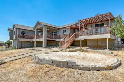 a house under construction with a large yard at On-Site Vineyard Gem on 10 Acres in Pilot Hill! in Pilot Hill