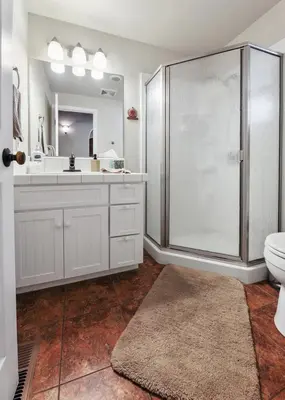 a bathroom with a shower and a toilet and a sink at Bear Hollow by Sequoia National Park in Three Rivers