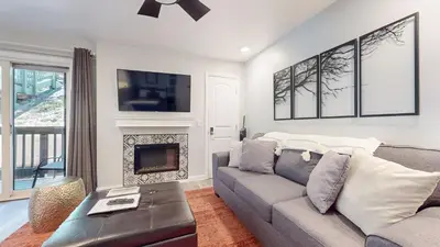 a living room with a couch and a fireplace at Hidden Valley #41 condo in Mammoth Lakes