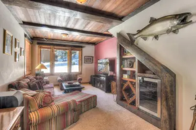 a living room with a fish on the wall at Ridge Court Barrel - Relax in Private Hot Tub in Olympic Valley