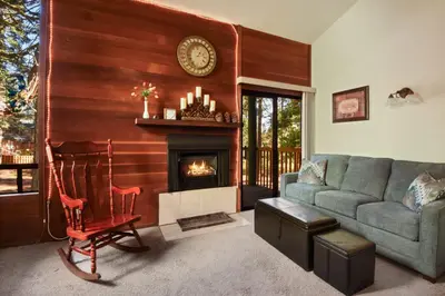 a living room with a couch and a fireplace at Regency Retreat - Studio for 2 in Tahoe Vista