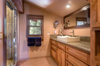 a bathroom with a sink and a mirror at Shoreline Vista - Lake Views Near Hike & Bike in Carnelian Bay