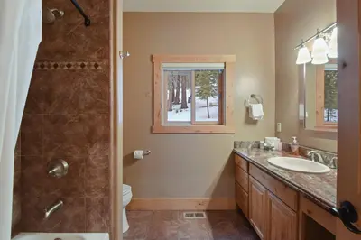 a bathroom with a shower and a sink and a toilet at Skislope Sanctuary - Close to Outdoor Activities in Truckee