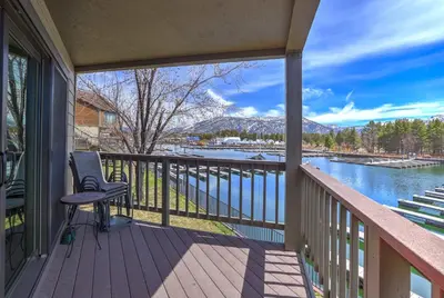 a balcony with a view of a river at Tahoe Keys Marina View - 3 BDR Desirable Community in South Lake Tahoe