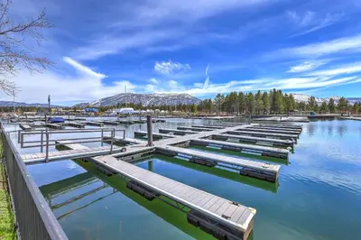 a marina with a bunch of boats in the water at Tahoe Keys Marina View - 3 BDR Desirable Community in South Lake Tahoe