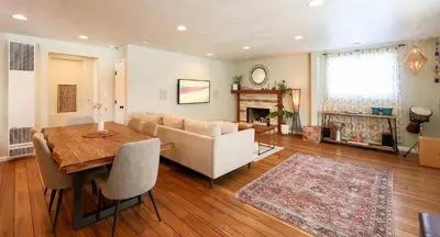 a living room with a table and a couch at Tahoe Trail Retreat - Steps from the TRT in Zephyr Cove