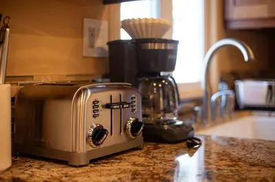 a toaster sitting on a counter in a kitchen at Tahoe Trail Retreat - Steps from the TRT in Zephyr Cove