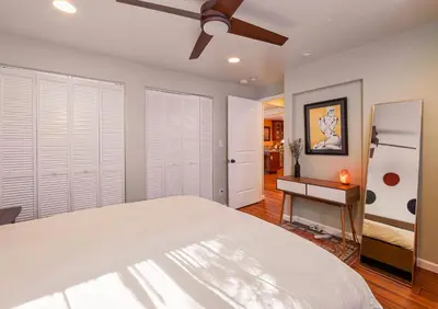a bedroom with a bed and a ceiling fan at Tahoe Trail Retreat - Steps from the TRT in Zephyr Cove