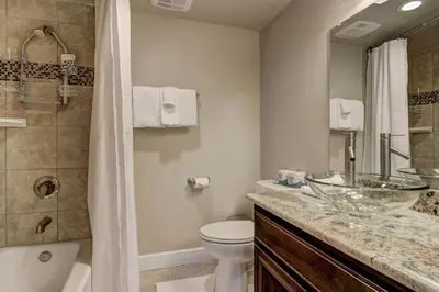 a bathroom with a sink and a toilet and a shower at Tahoe Woods Heavenly - Walk to beach & Gondola to Heavenly Ski in South Lake Tahoe