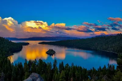 a view of a lake at sunset with trees at Tahoe Woods Heavenly - Walk to beach & Gondola to Heavenly Ski in South Lake Tahoe