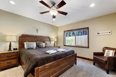 a bedroom with a bed and a ceiling fan at Tahoe Woods Villa - Walk to Beach and Gondola - Heavenly Ski in South Lake Tahoe
