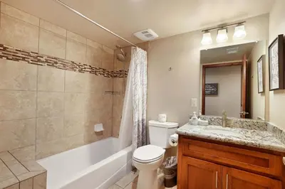 a bathroom with a tub and a toilet and a sink at Tahoe Woods Villa - Walk to Beach and Gondola - Heavenly Ski in South Lake Tahoe