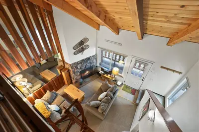 an overhead view of a living room with a stone fireplace at Valley View - Carson Valley Views in Stateline
