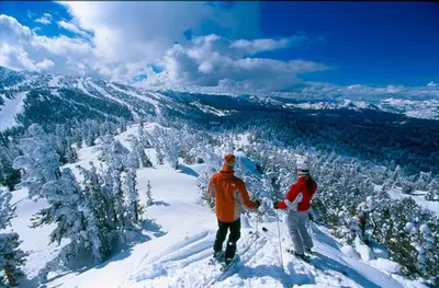 two people standing on top of a snow covered mountain at Zephyr Cove Cabin - Walk to Lake & Beach in Zephyr Cove