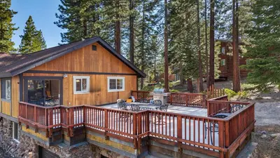a home with a deck and a house at Geraldine Drive by AvantStay Hot Tub Views Walk to Trails Game Room in Incline Village