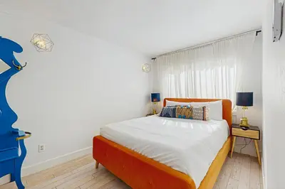 a bedroom with a large bed and a window at Family Friendly! Incline Village Condo with Foosball in Tyrolian Village