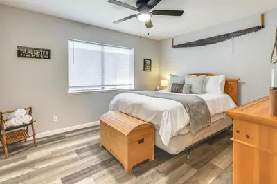 a bedroom with a bed and a ceiling fan at Peaceful Forest Views and Patio Twain Harte Home in Twain Harte